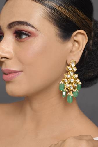 Handcrafted kundan floral earrings with green beads