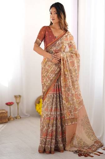 Beige handloom cotton saree with rust blouse and village celebration print