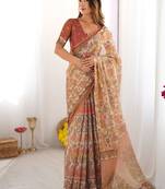 Beige handloom cotton saree with rust blouse and village celebration print