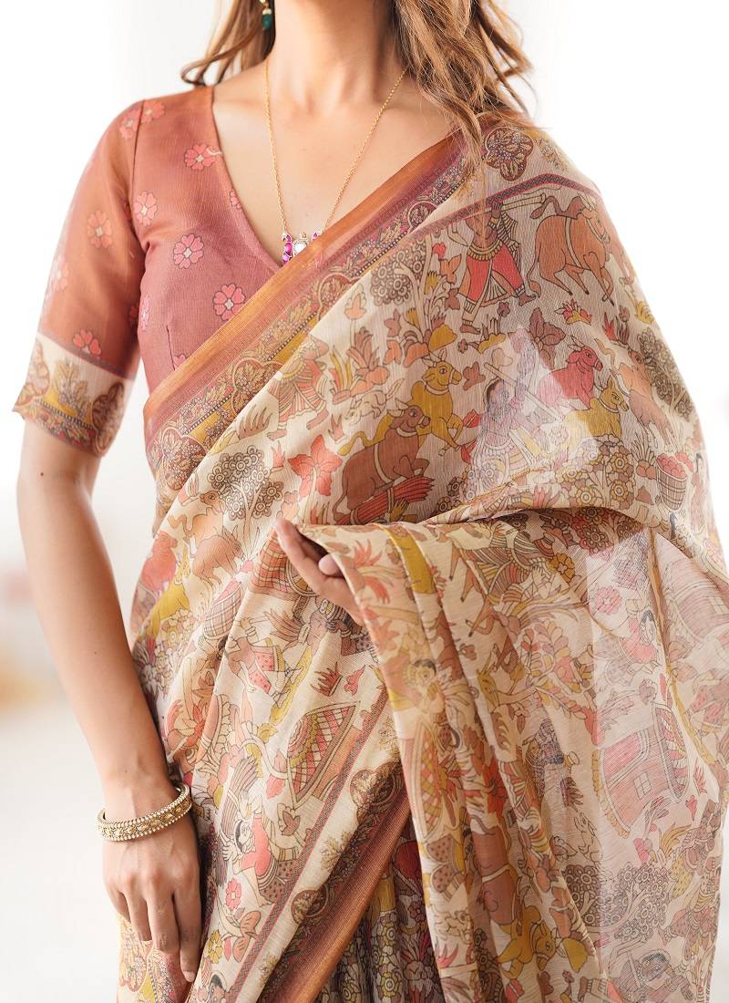 Beige handloom cotton saree with rust blouse and village celebration print
