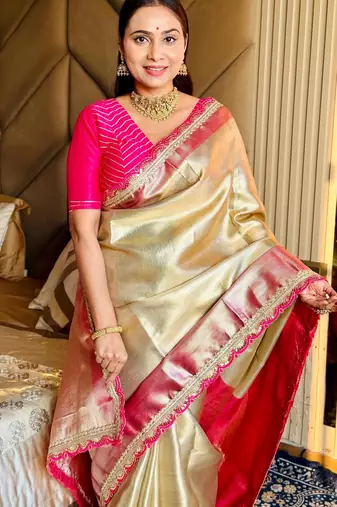 cream color tissue art silk saree with contrast blouse