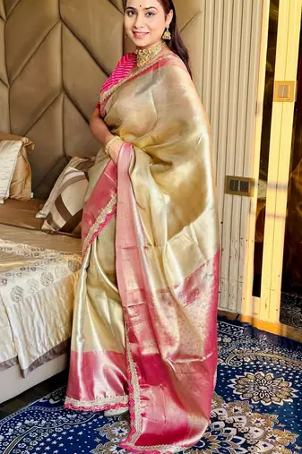 cream color tissue art silk saree with contrast blouse