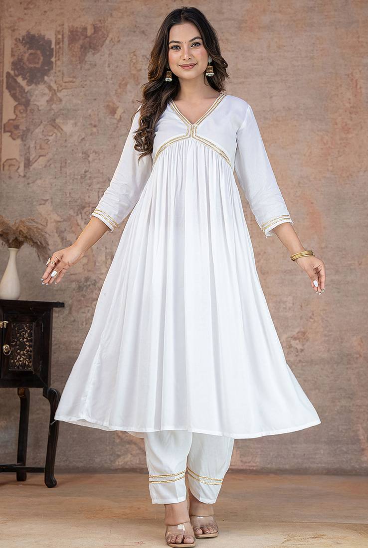 White lace solid rayon stitched v-neck flared pant suit set