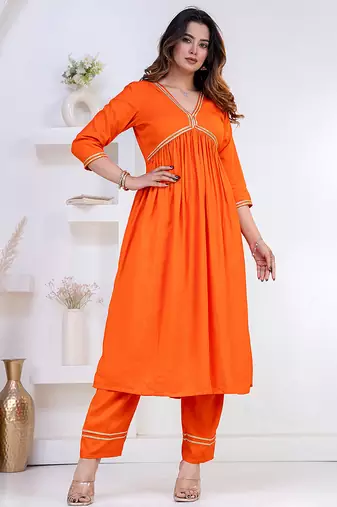 Orange lace solid rayon stitched v-neck flared pant suit set