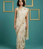 beige chain stitch crossstitch embroidered tussar art silk festive wear saree with unstitched blouse