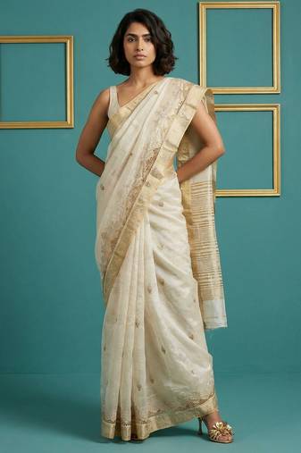 beige chain stitch cutwork embroidered tussar art silk festive wear saree with unstitched blouse