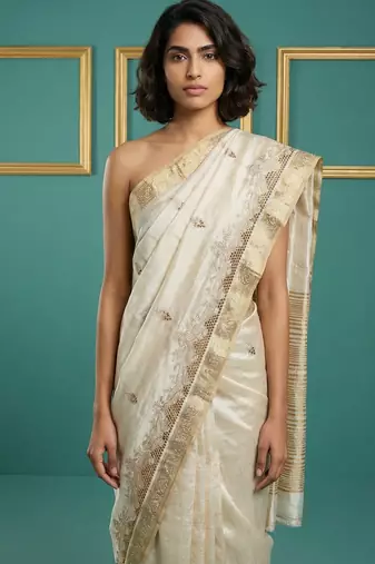 beige chain stitch cutwork embroidered tussar art silk festive wear saree with unstitched blouse