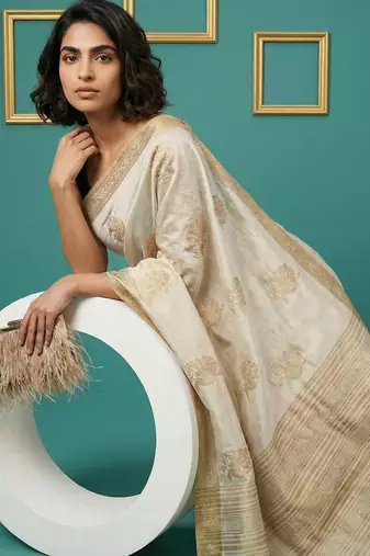 beige chain stitch crossstitch embroidered tussar art silk festive wear saree with unstitched blouse