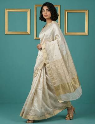 beige chain stitch cutwork embroidered tussar art silk festive wear saree with unstitched blouse 3