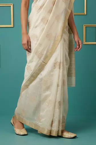 beige chain stitch crossstitch embroidered tussar art silk festive wear saree with unstitched blouse