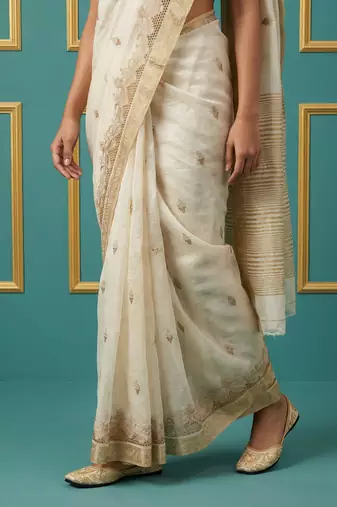 beige chain stitch cutwork embroidered tussar art silk festive wear saree with unstitched blouse