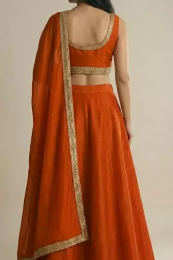 burnt orange silk designer lehenga set with gold border dupatta