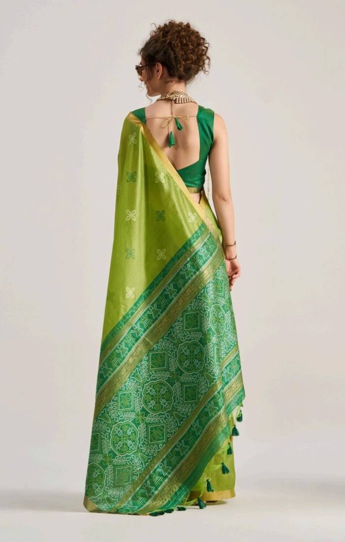 green premium art silk patola saree with traditional weaving design