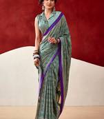 green fancy printed dull satin saree with matching blouse