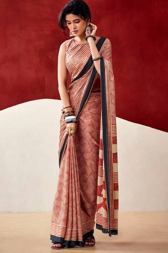 orange fancy printed dull satin saree with matching blouse