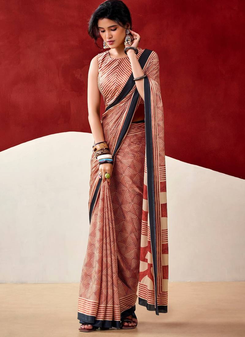 orange fancy printed dull satin saree with matching blouse