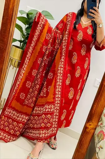 Floral printed orange  cotton  kurta trouser and dupatta set