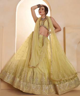 Sparkling Yellow Thread Embroidered Net Engagement Wear Lehenga Choli 3