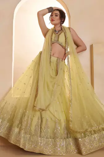 Sparkling Yellow Thread Embroidered Net Engagement Wear Lehenga Choli