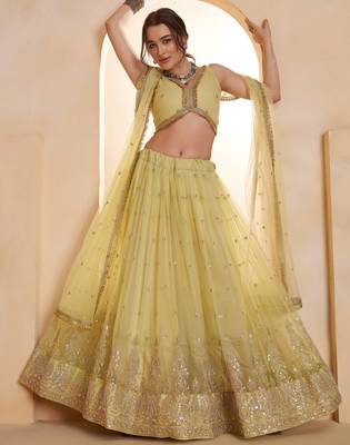 Sparkling Yellow Thread Embroidered Net Engagement Wear Lehenga Choli 4
