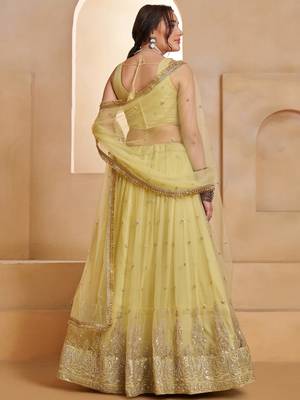 Sparkling Yellow Thread Embroidered Net Engagement Wear Lehenga Choli 5