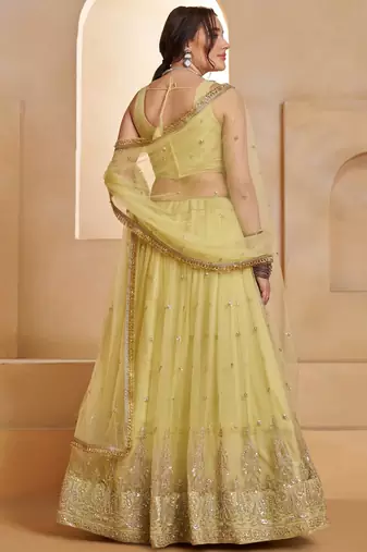 Sparkling Yellow Thread Embroidered Net Engagement Wear Lehenga Choli