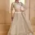 Fantastic Off-White Thread Embroidered Net Wedding Wear Lehenga Choli