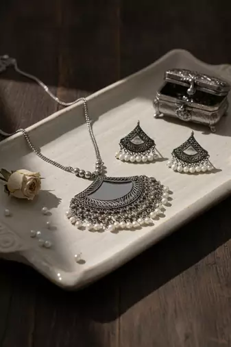 Nvr women oxidised silver finish mirror work necklace with earrings set