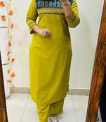 Floral embroidered yellow round neck cotton kurta set with trouser