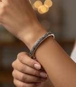 Nvr women oxidized silver plated paisley & floral carved kada bangle