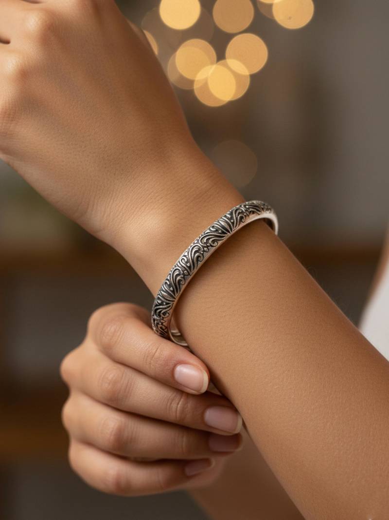 Nvr women oxidized silver plated paisley & floral carved kada bangle