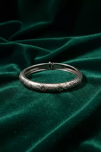 Nvr women oxidized silver plated paisley & floral carved kada bangle