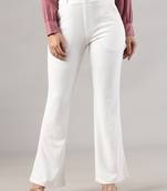 Women solid white regular fit mid-rise flat front trousers