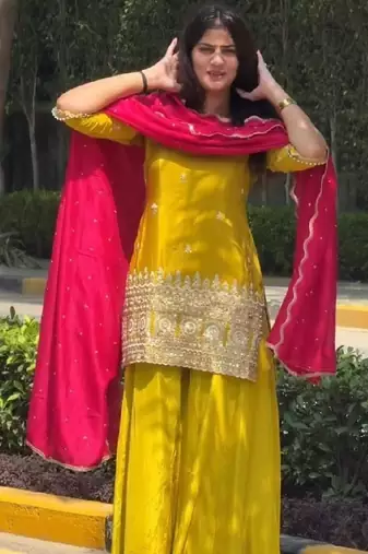 Yellow kurta sharara set with pink dupatta