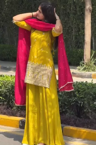 Yellow kurta sharara set with pink dupatta