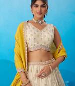 Cream- Tissue Sequins Embroidered Semi-Stitched Lehenga & Unstitched Blouse With Dupatta