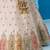 Cream- Tissue Sequins Embroidered Multicolor Patch Work Semi-Stitched Lehenga & Unstitched Blouse With Dupatta