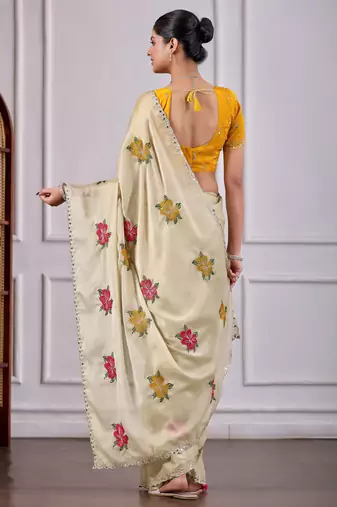Beige rangoli saree with floral embroidery & mirror work