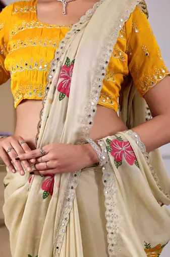 Beige rangoli saree with floral embroidery & mirror work
