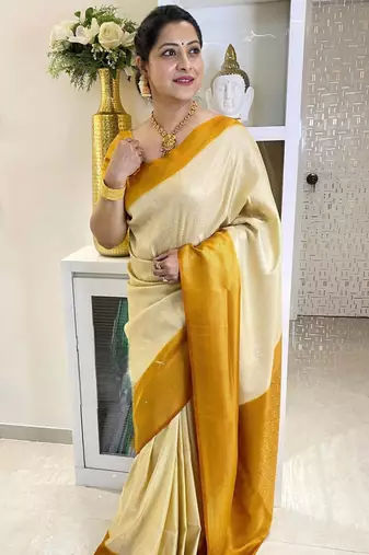 latest cream self design art art silk jacquard saree with unstitched blouse