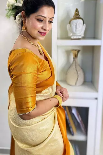  cream self design art art silk jacquard saree with unstitched blouse