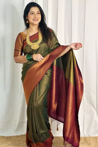 embellished dark green self design silk cotton saree with unstitched blouse
