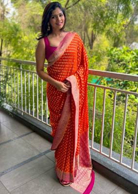 celebrity inspired orange banarasi art silk blend light weight saree with unstitched blouse 1