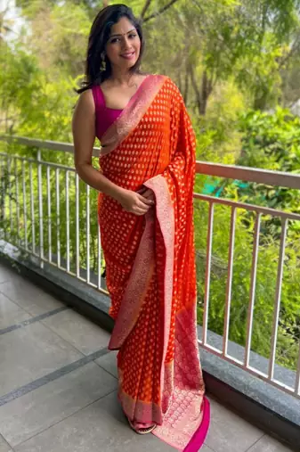 celebrity inspired orange banarasi art silk blend light weight saree with unstitched blouse