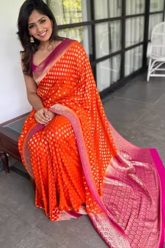 celebrity inspired orange banarasi art silk blend light weight saree with unstitched blouse
