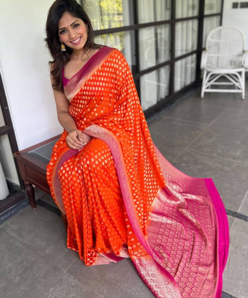 celebrity inspired orange banarasi art silk blend light weight saree with unstitched blouse