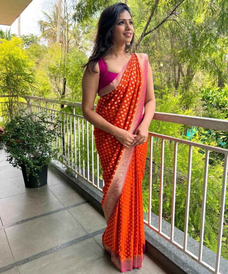 celebrity inspired orange banarasi art silk blend light weight saree with unstitched blouse