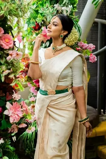  cream self design silk cotton fancy saree with unstitched blouse