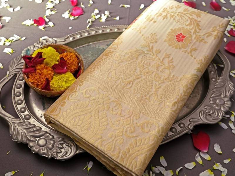 soft cream banarasi art silk blend light weight saree with unstitched blouse