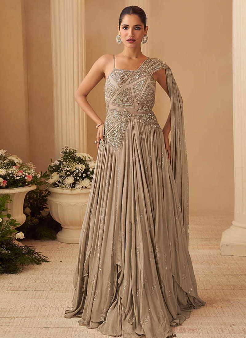 Beige chinon silk one shoulder sequins flared gown semi stitched up to 42" size